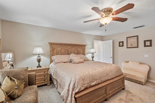 an aerial view of a house with a swimming pool and outdoor space