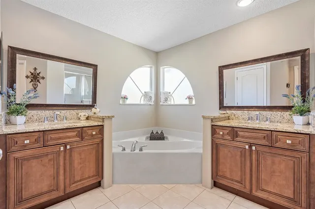 a view of a lake with houses in the back