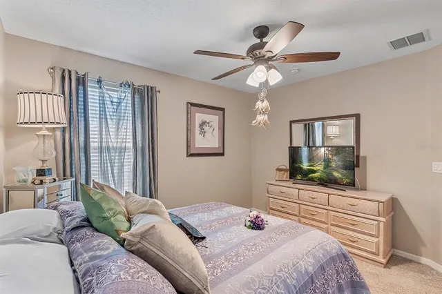 a view of a balcony with wooden floor and fence