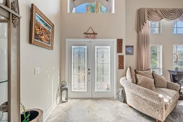 a living room with furniture and a large window