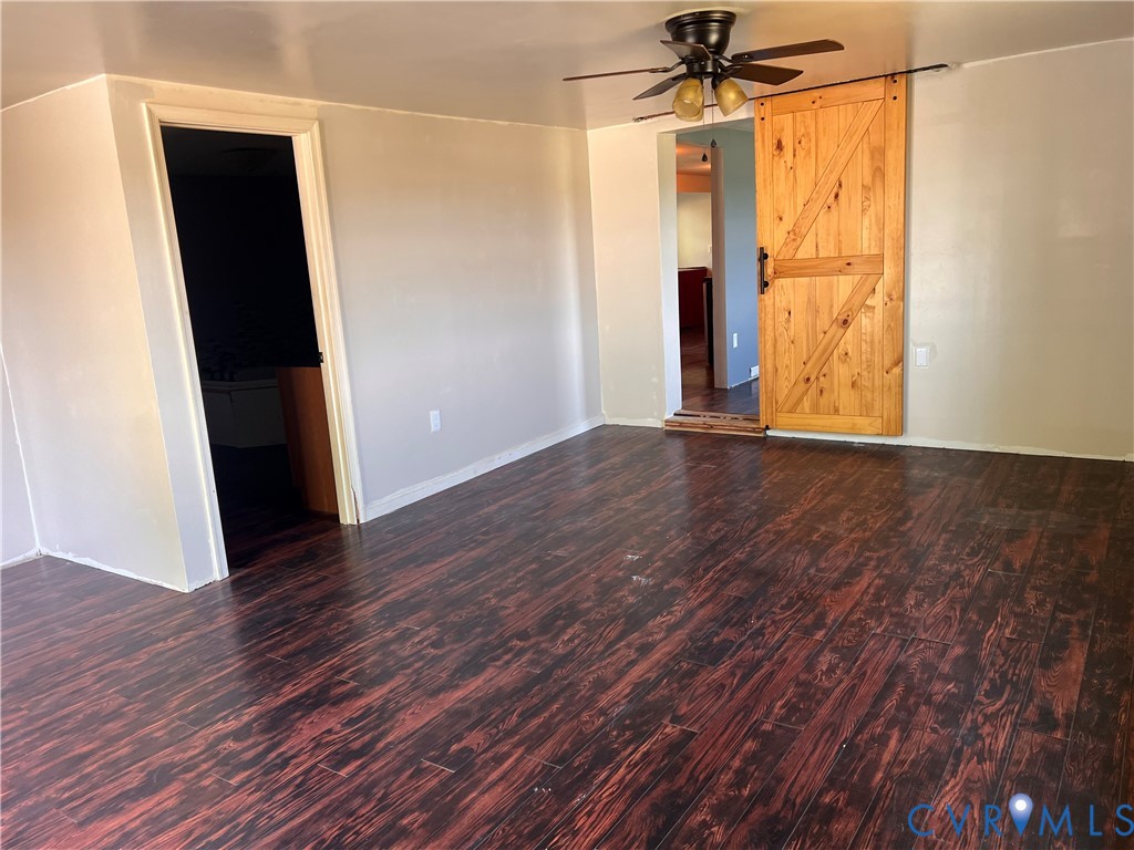 36210 Owens Grove Road Waverly, VA 23890 - Photo 13 of 24 wooden floor in an empty room with a window