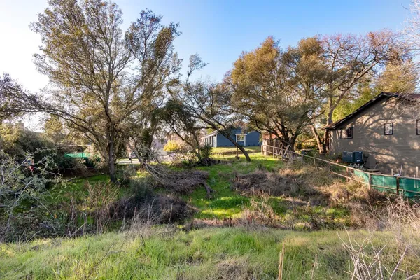a backyard of a house with lots of green space