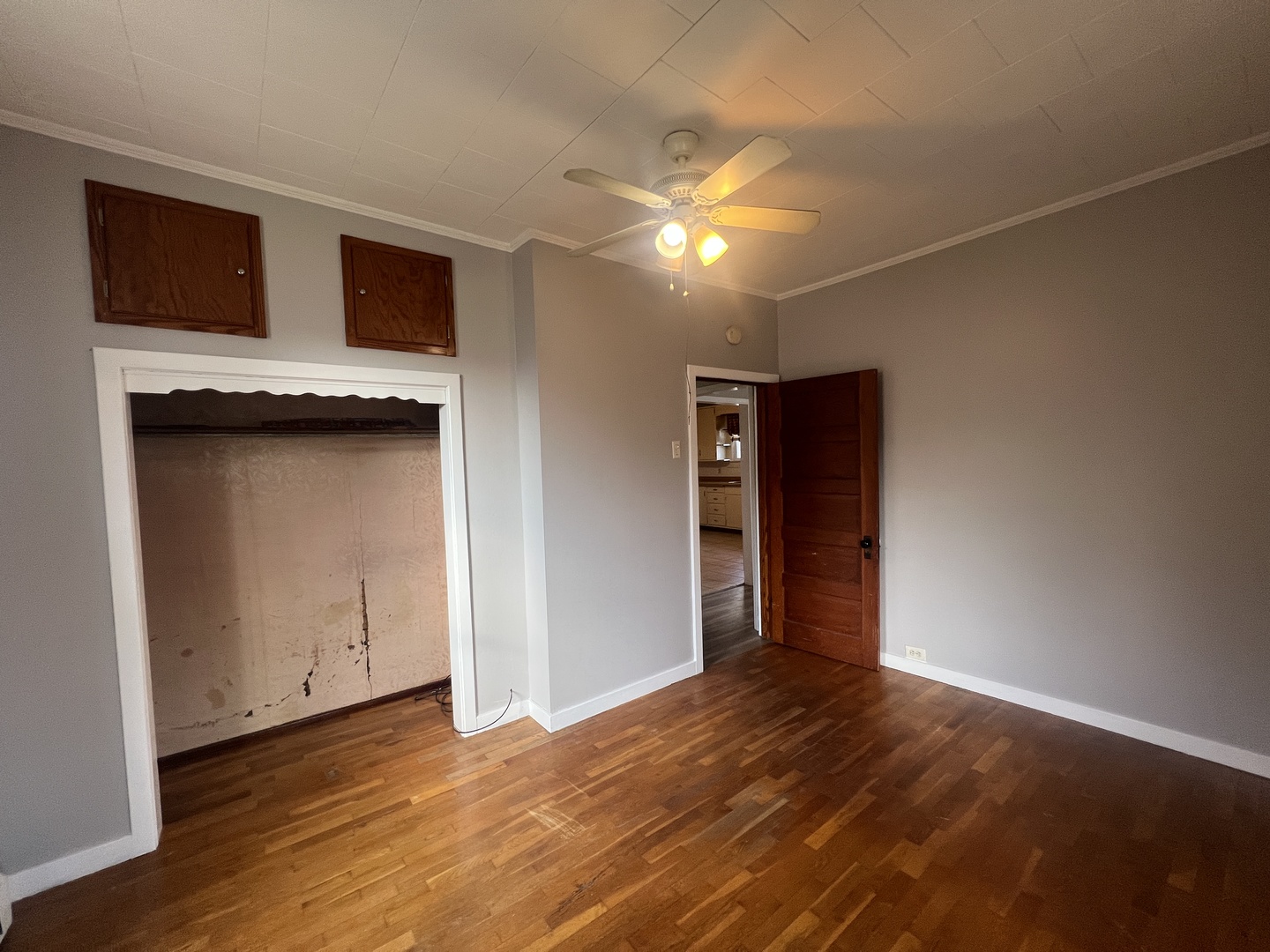 1109 West Adams Street Herrin, IL 62948 - Photo 17 of 27 a view of an empty room with wooden floor and a window