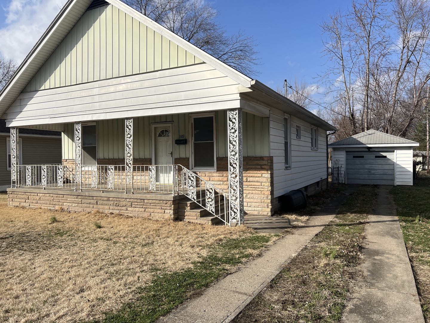 1109 West Adams Street Herrin, IL 62948 - Photo 2 of 27 a view of a house with backyard and porch