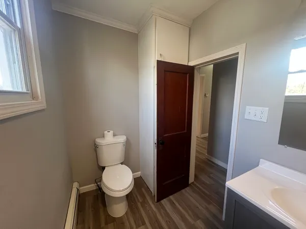 a bathroom with a toilet and a sink