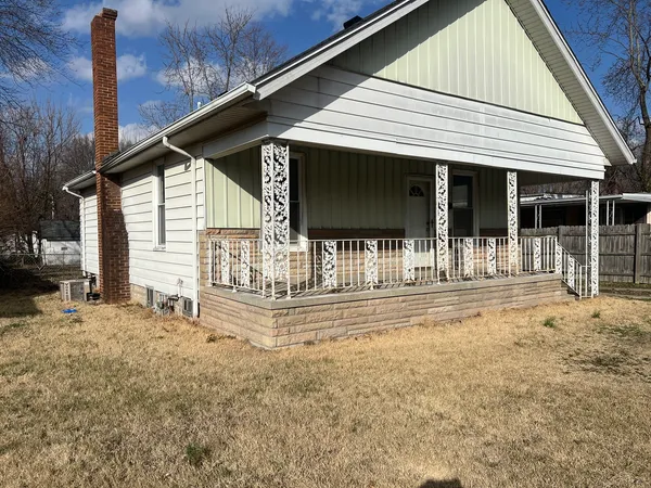 a view of a house with a outdoor seating