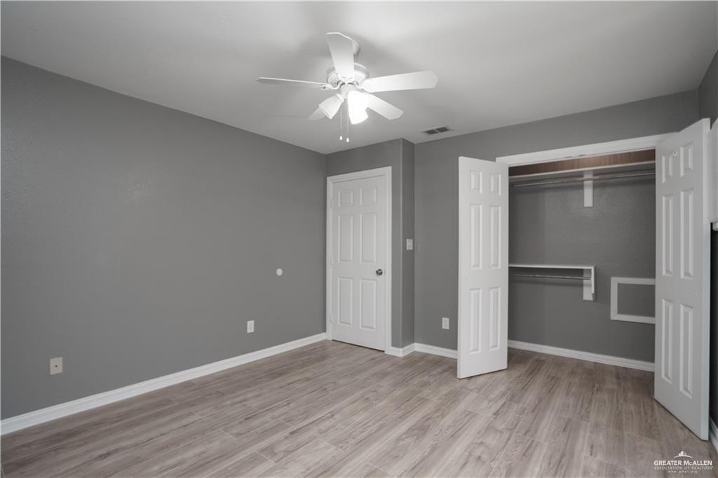 1918 Angus Street, Unit 3 Mission, TX 78572 - Photo 12 of 15 a view of an empty room with wooden floor