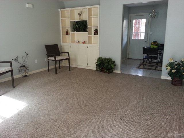 1918 Angus Street, Unit 3 Mission, TX 78572 - Photo 15 of 15 a living room with furniture and a flat screen tv