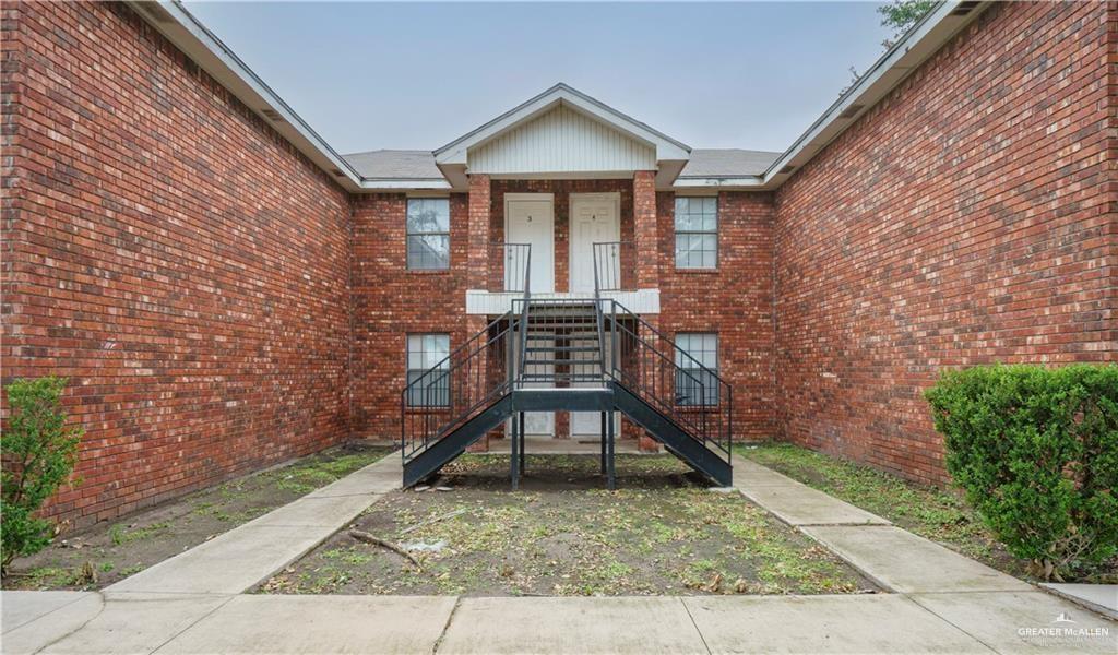 1918 Angus Street, Unit 3 Mission, TX 78572 - Photo 2 of 15 a view of an wooden chairs and a table in the patio