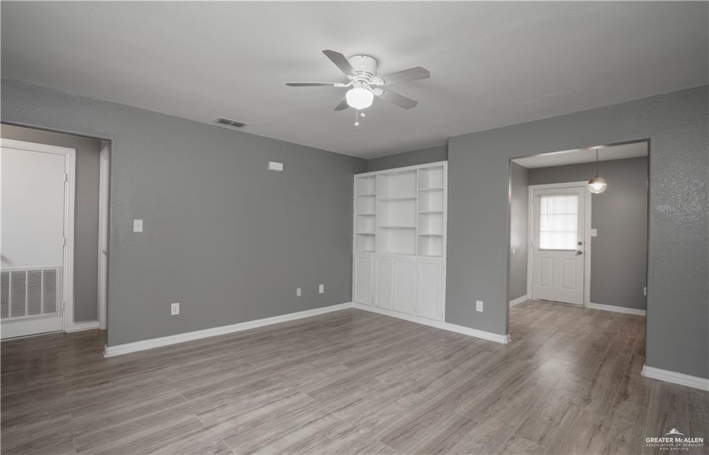 1918 Angus Street, Unit 3 Mission, TX 78572 - Photo 5 of 15 a view of an empty room with wooden floor