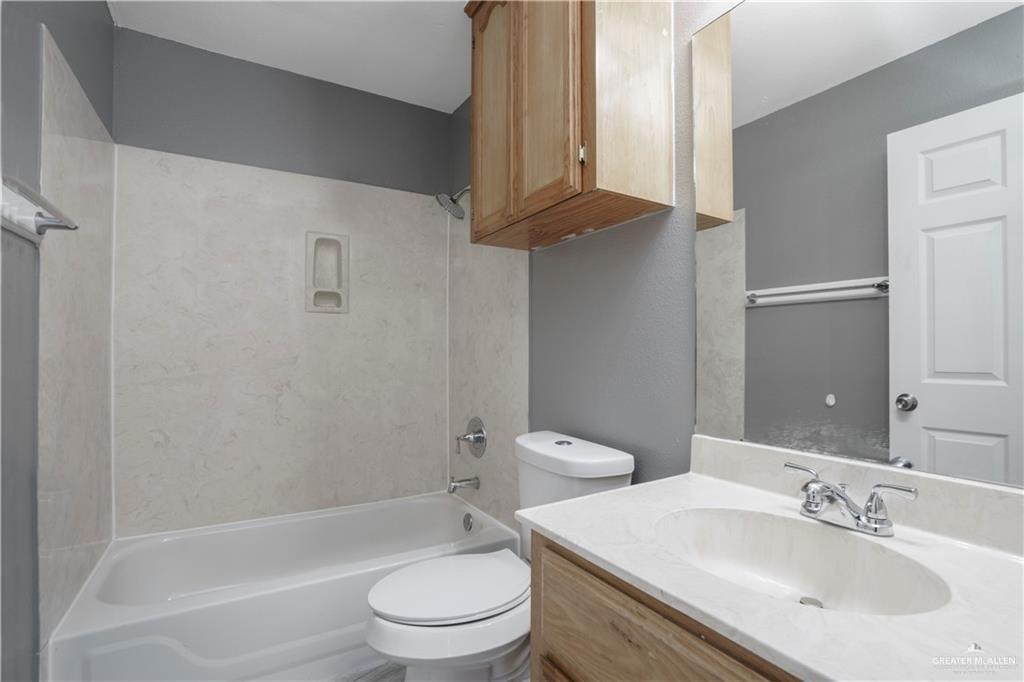 1918 Angus Street, Unit 3 Mission, TX 78572 - Photo 8 of 15 a bathroom with a sink toilet and shower