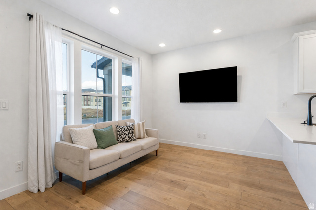 3473 Hardman Way Lehi, UT 84048 - Photo 7 of 22 Living room featuring light wood-type flooring and recessed lighting