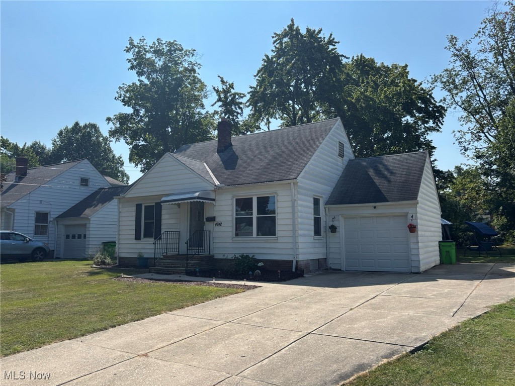 4742 Anderson Road Cleveland, OH 44124 - Photo 2 of 36 1-car attached garage and driveway with extended parking area.
