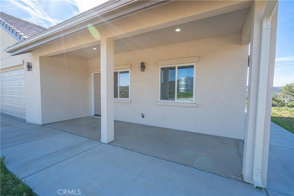 10540 Darling Road Agua Dulce, CA 91390 - Photo 12 of 56 an empty room with windows