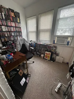 a room with gym equipment and a window