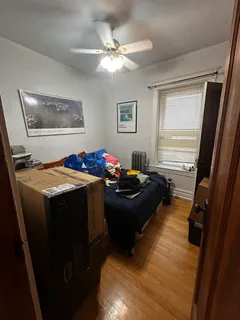 a bed room with a bed furniture and a window