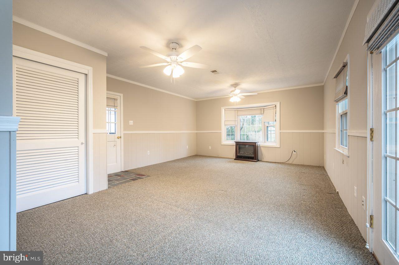 7924 Wellington Road Alexandria, VA 22308 - Photo 17 of 35 Family room with door to extended driveway
