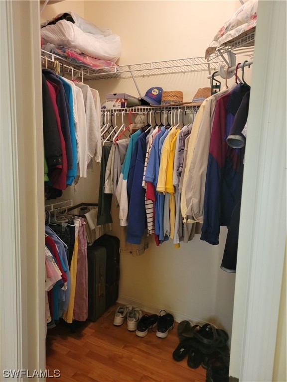 10720 Blue Bimini Circle Estero, FL 33928 - Photo 12 of 28 a view of walk in closet with clothes and shoes