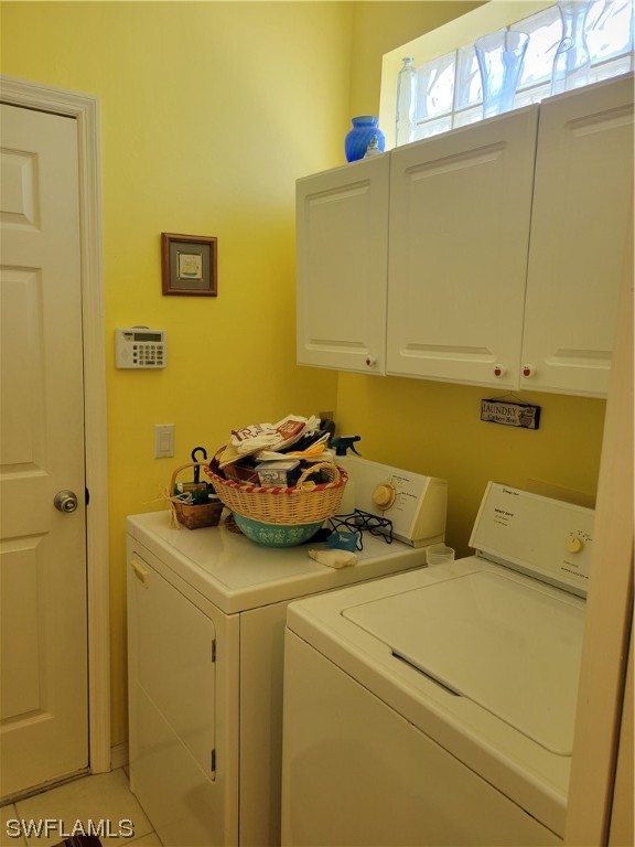 10720 Blue Bimini Circle Estero, FL 33928 - Photo 19 of 28 a utility room with dryer and washer