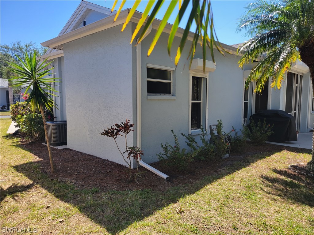 10720 Blue Bimini Circle Estero, FL 33928 - Photo 25 of 28 a view of a backyard