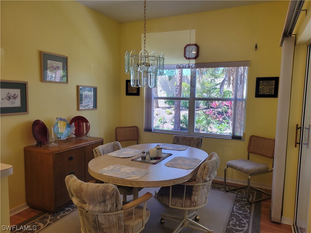 10720 Blue Bimini Circle Estero, FL 33928 - Photo 6 of 28 a view of a dining room with furniture and a window