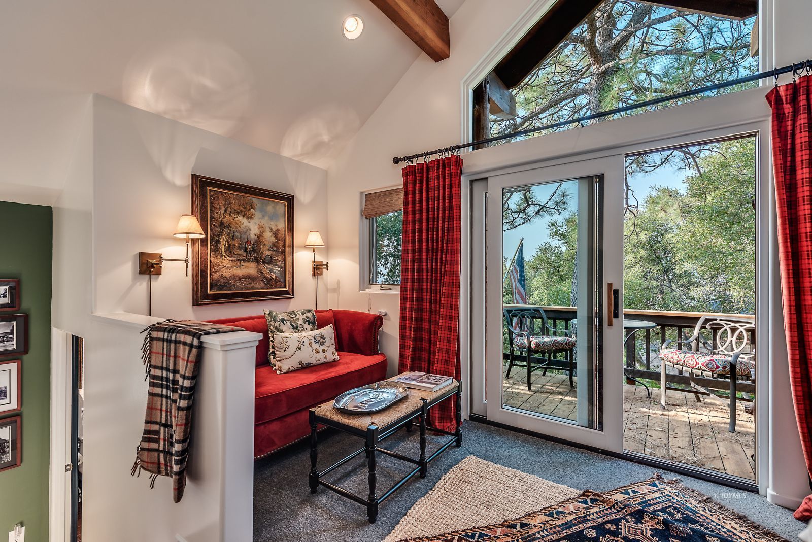 52430 Double View Drive Idyllwild, CA 92549 - Photo 17 of 75 a living room with furniture a flat screen tv and a floor to ceiling window
