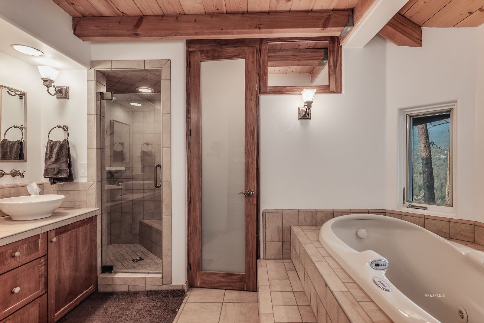 52430 Double View Drive Idyllwild, CA 92549 - Photo 56 of 75 a bathroom with a tub a sink and mirror