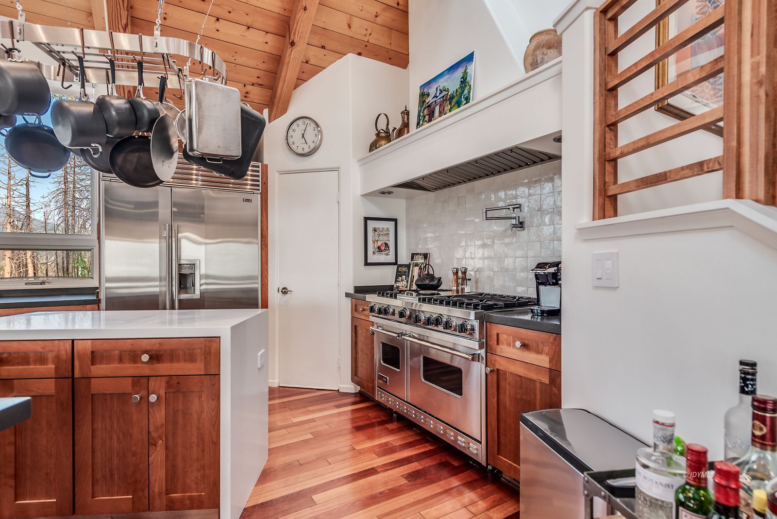 52430 Double View Drive Idyllwild, CA 92549 - Photo 58 of 75 a kitchen with a stove cabinets and wooden floor