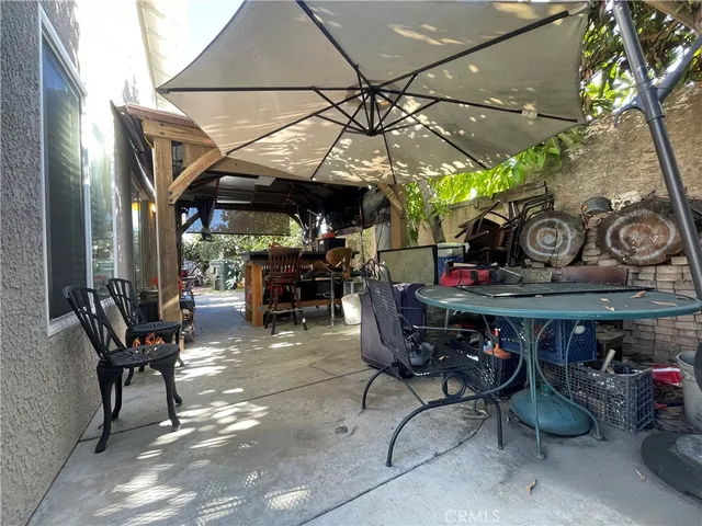 a view of a chairs and tables in patio