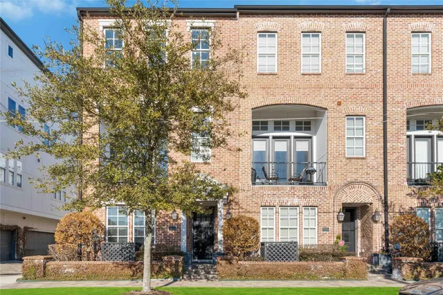 a front view of a building with garden