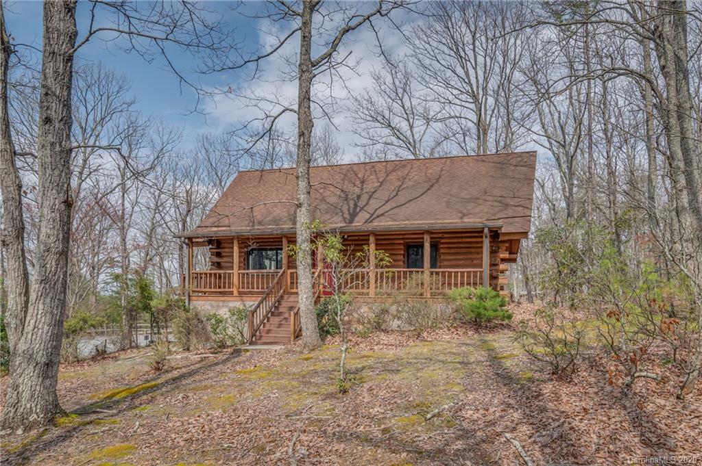 83 Luther Durham Road Tryon, NC 28782 - Photo 1 of 43 front view of house with a dry yard