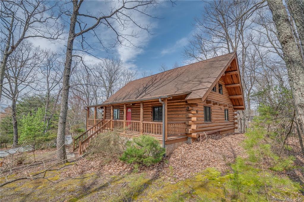 83 Luther Durham Road Tryon, NC 28782 - Photo 2 of 43 a view of a house with a yard and wooden fence