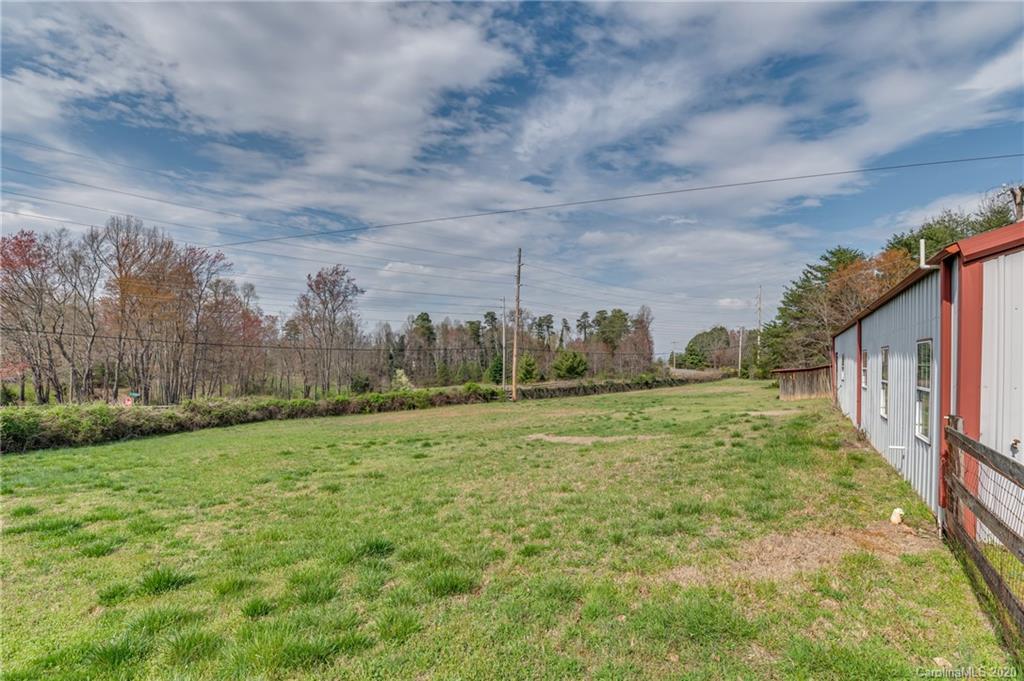 83 Luther Durham Road Tryon, NC 28782 - Photo 11 of 43 a fire hydrant in the middle of a field