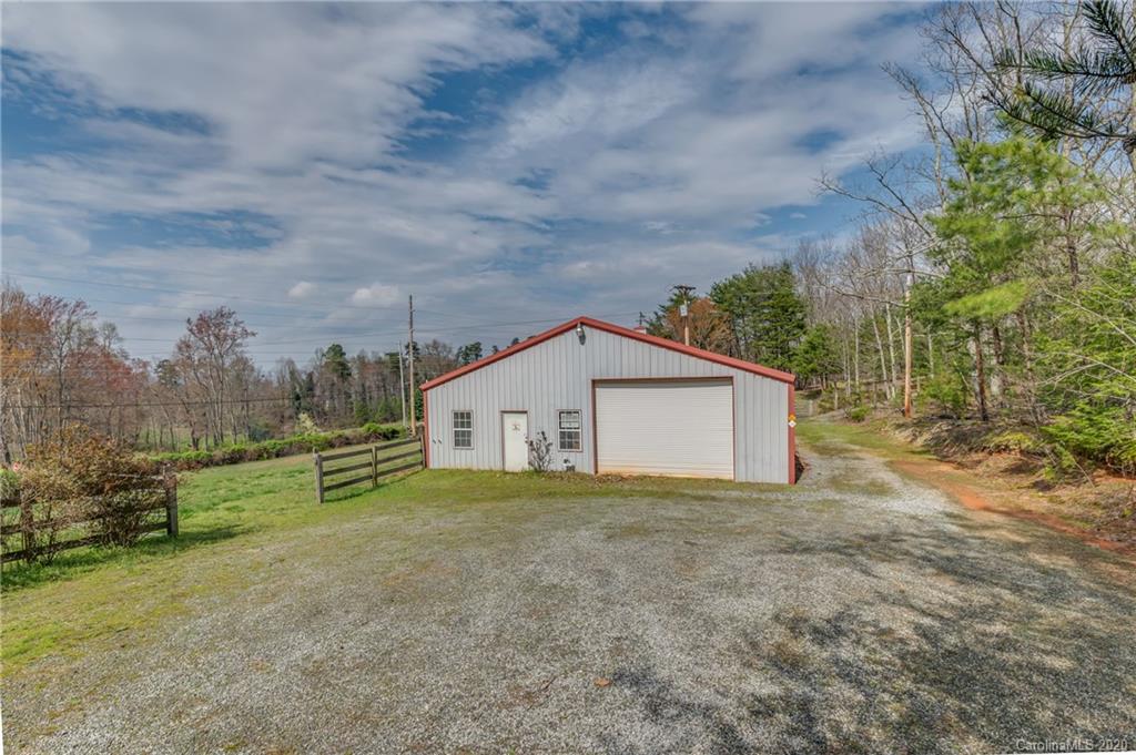 83 Luther Durham Road Tryon, NC 28782 - Photo 12 of 43 a view of a house with a yard and tree s
