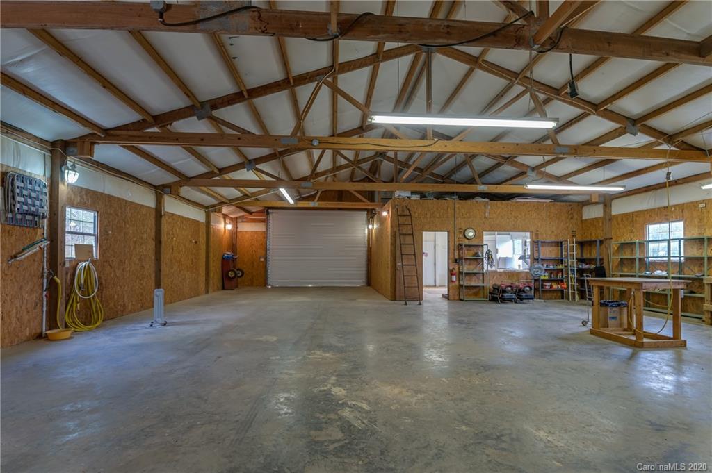 83 Luther Durham Road Tryon, NC 28782 - Photo 17 of 43 a view of empty room with wooden ceiling