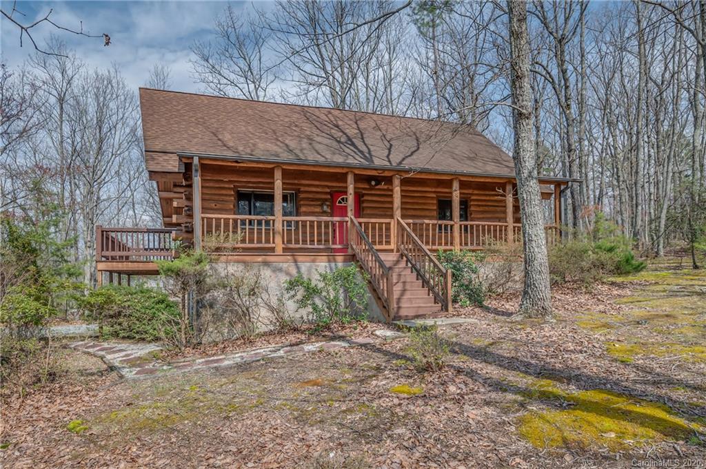 83 Luther Durham Road Tryon, NC 28782 - Photo 3 of 43 a front view of a house with garden