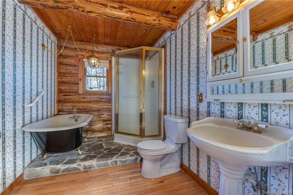 83 Luther Durham Road Tryon, NC 28782 - Photo 29 of 43 a bathroom with a sink and a mirror
