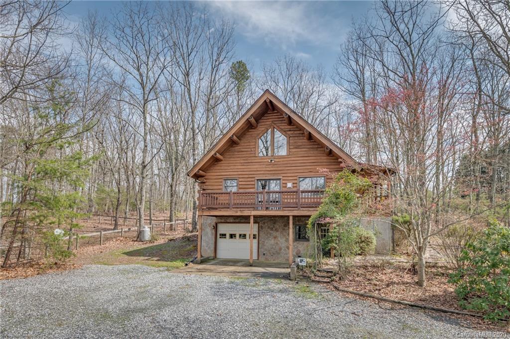 83 Luther Durham Road Tryon, NC 28782 - Photo 4 of 43 a front view of house with a garden