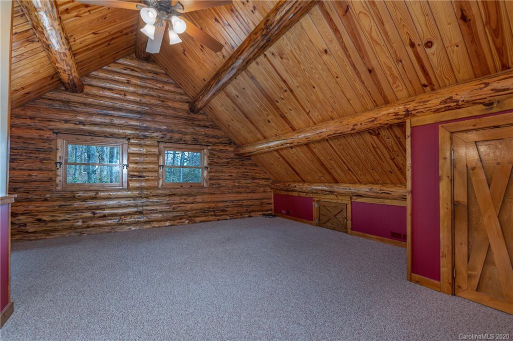 83 Luther Durham Road Tryon, NC 28782 - Photo 32 of 43 a view of an empty room with a fireplace
