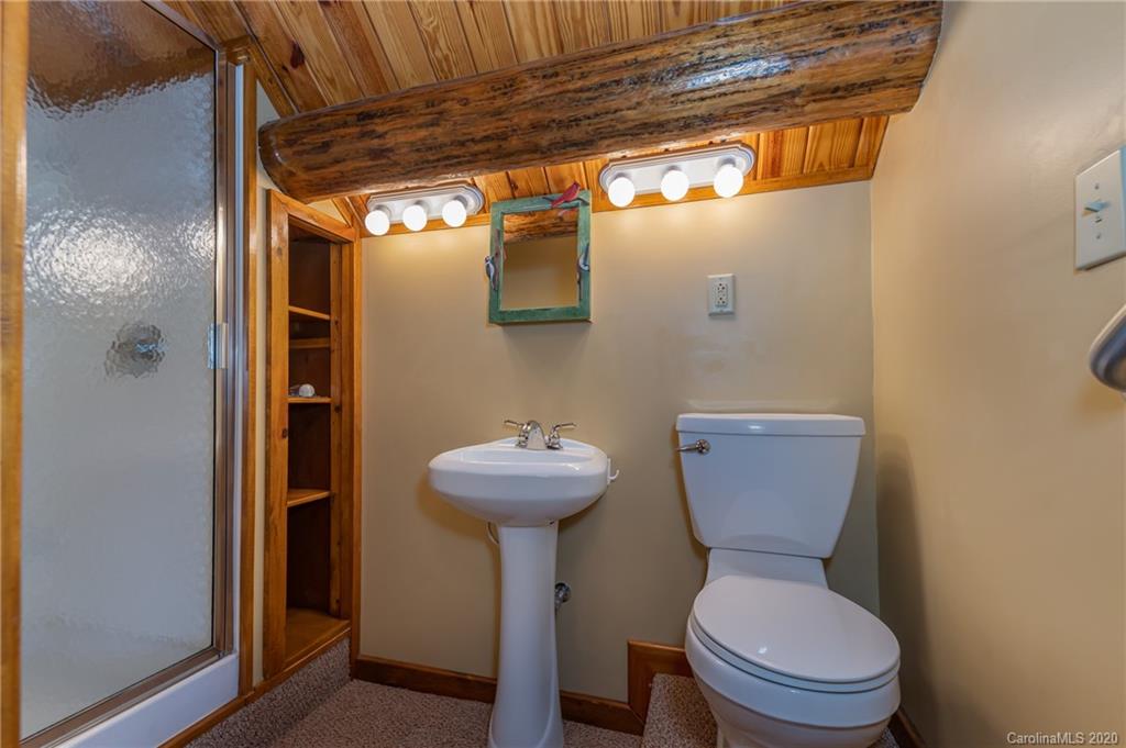 83 Luther Durham Road Tryon, NC 28782 - Photo 34 of 43 a bathroom with a sink and a toilet