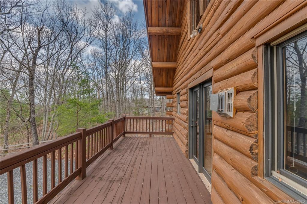 83 Luther Durham Road Tryon, NC 28782 - Photo 41 of 43 a view of a balcony with wooden floor