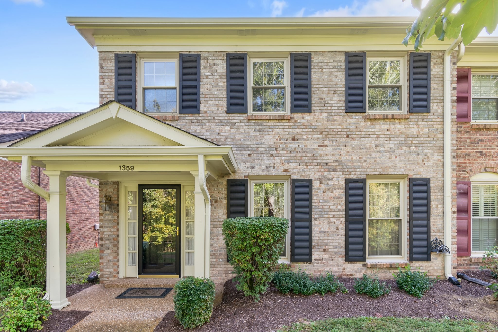 1359 General George Patton Road Nashville, TN 37221 - Photo 1 of 41 front view of a brick house with a large windows