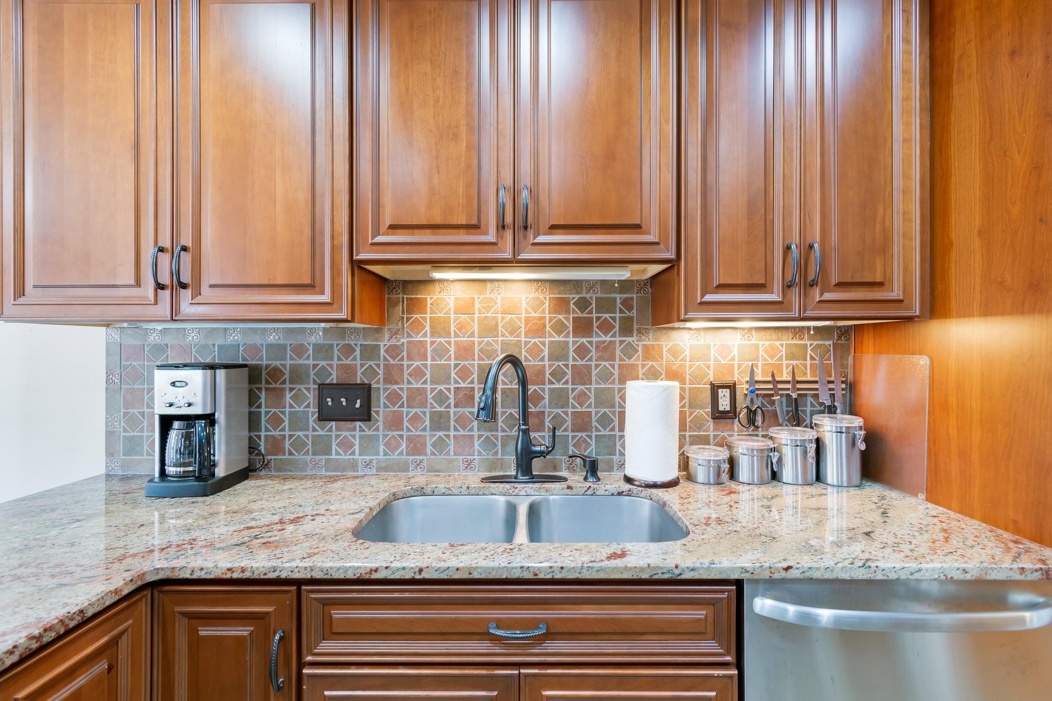 1359 General George Patton Road Nashville, TN 37221 - Photo 17 of 41 a kitchen with granite countertop a sink a stove and cabinets