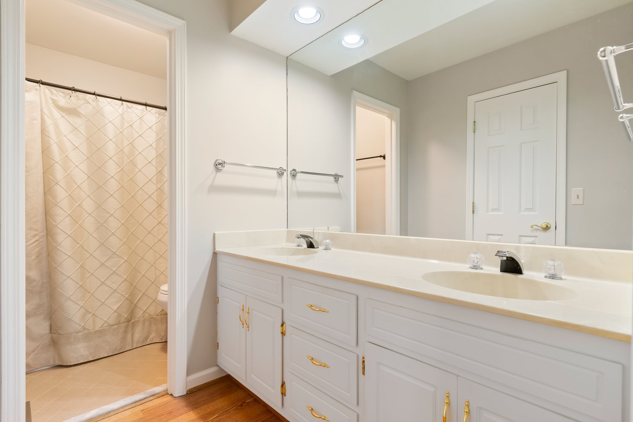 1359 General George Patton Road Nashville, TN 37221 - Photo 30 of 41 a bathroom with a double vanity sink and mirror