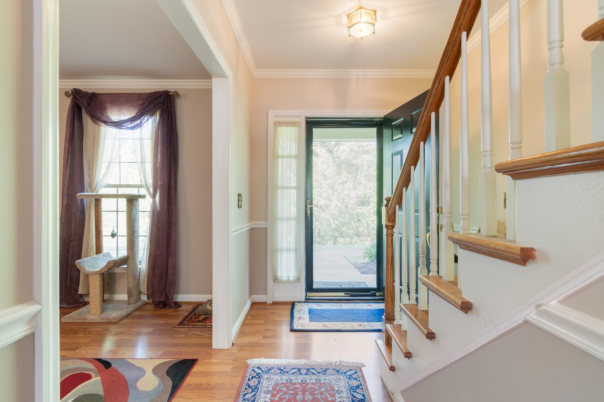 1359 General George Patton Road Nashville, TN 37221 - Photo 7 of 41 a view of an entryway with wooden floor and a livingroom