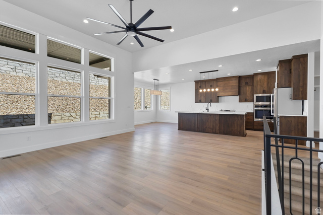 710 East Mountain Road North Ogden, UT 84414 - Photo 6 of 36 Unfurnished living room featuring ceiling fan, light wood-style floors, and recessed lighting