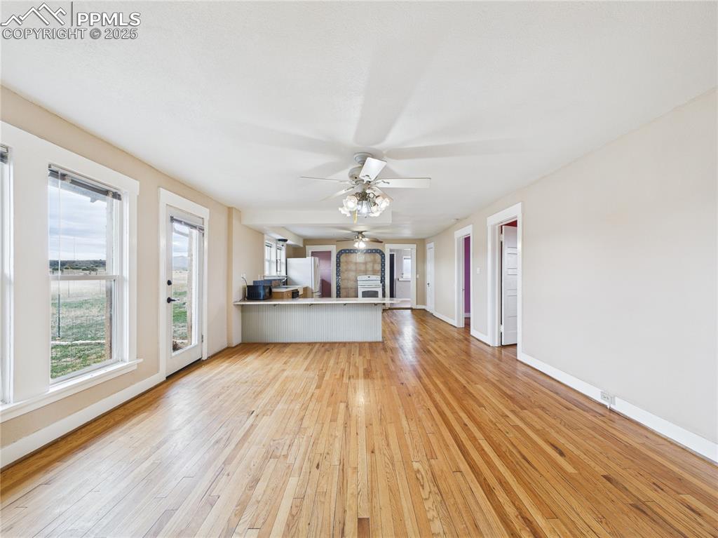 6601 Pickney Road Rye, CO 81069 - Photo 13 of 33 a view of a kitchen with wooden floor a kitchen space a sink a refrigerator and window