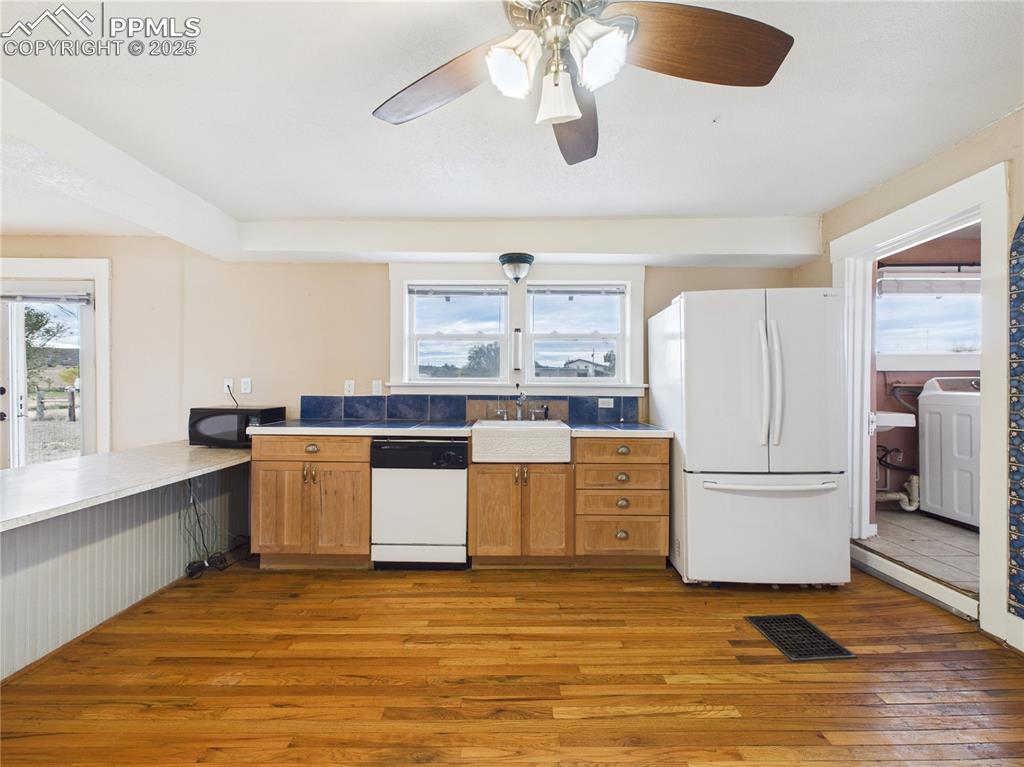 6601 Pickney Road Rye, CO 81069 - Photo 19 of 33 a kitchen with stainless steel appliances granite countertop a stove a refrigerator and a white cabinets