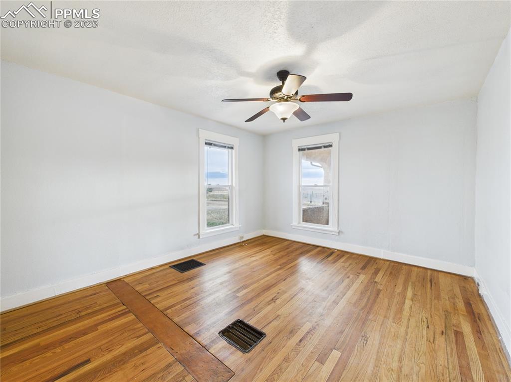 6601 Pickney Road Rye, CO 81069 - Photo 8 of 33 a view of empty room with wooden floor and fan
