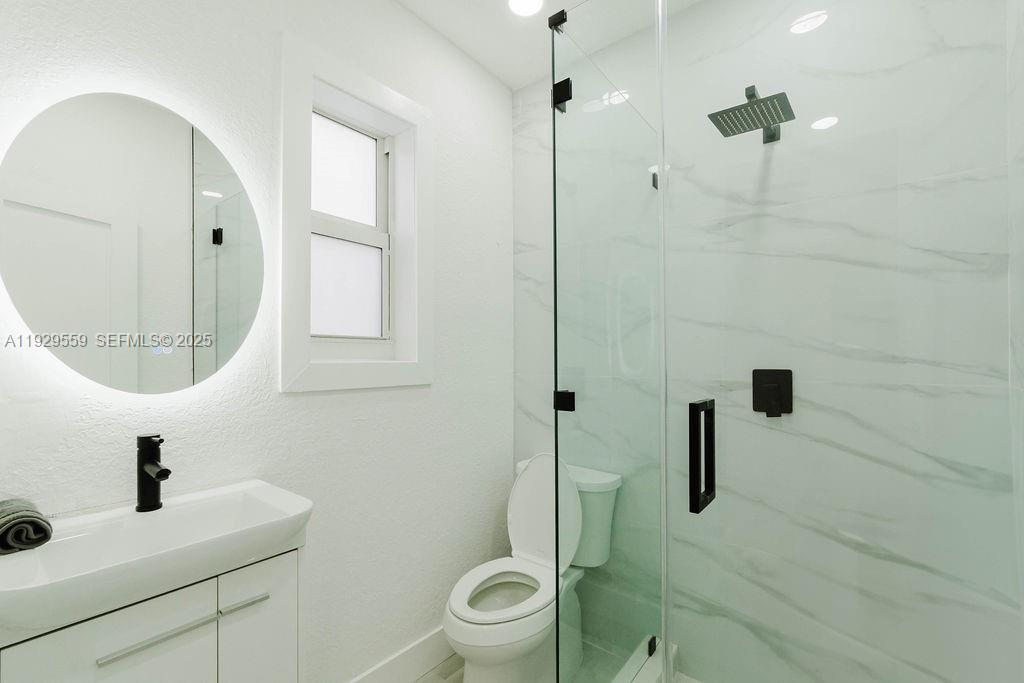 2101 Southwest 16th Terrace Miami, FL 33145 - Photo 23 of 55 a bathroom with a sink toilet and shower